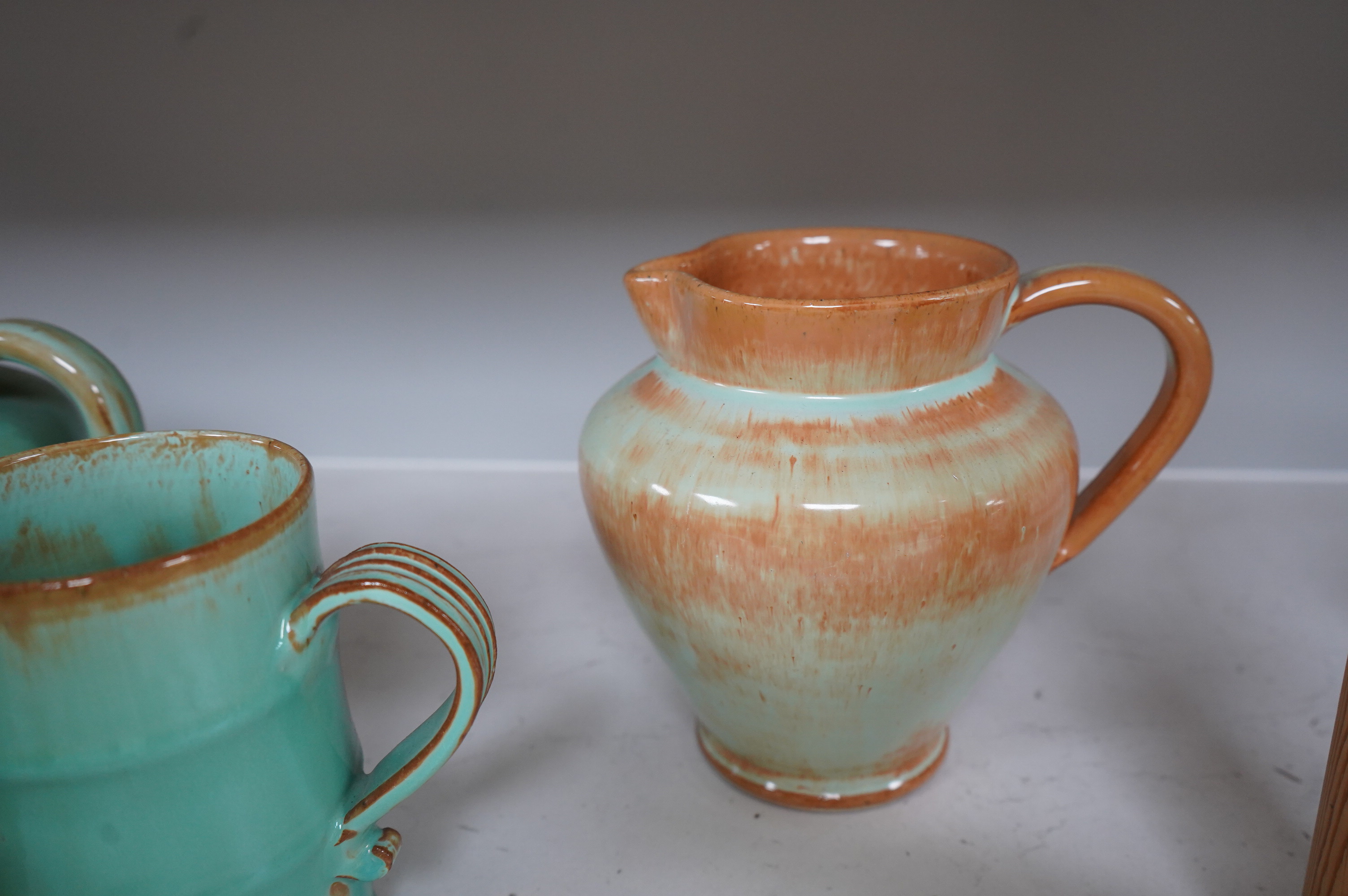 Ten items of Dickerware pottery, including a Uriah Clark and Nephew trio of connected jugs, tallest 21cm